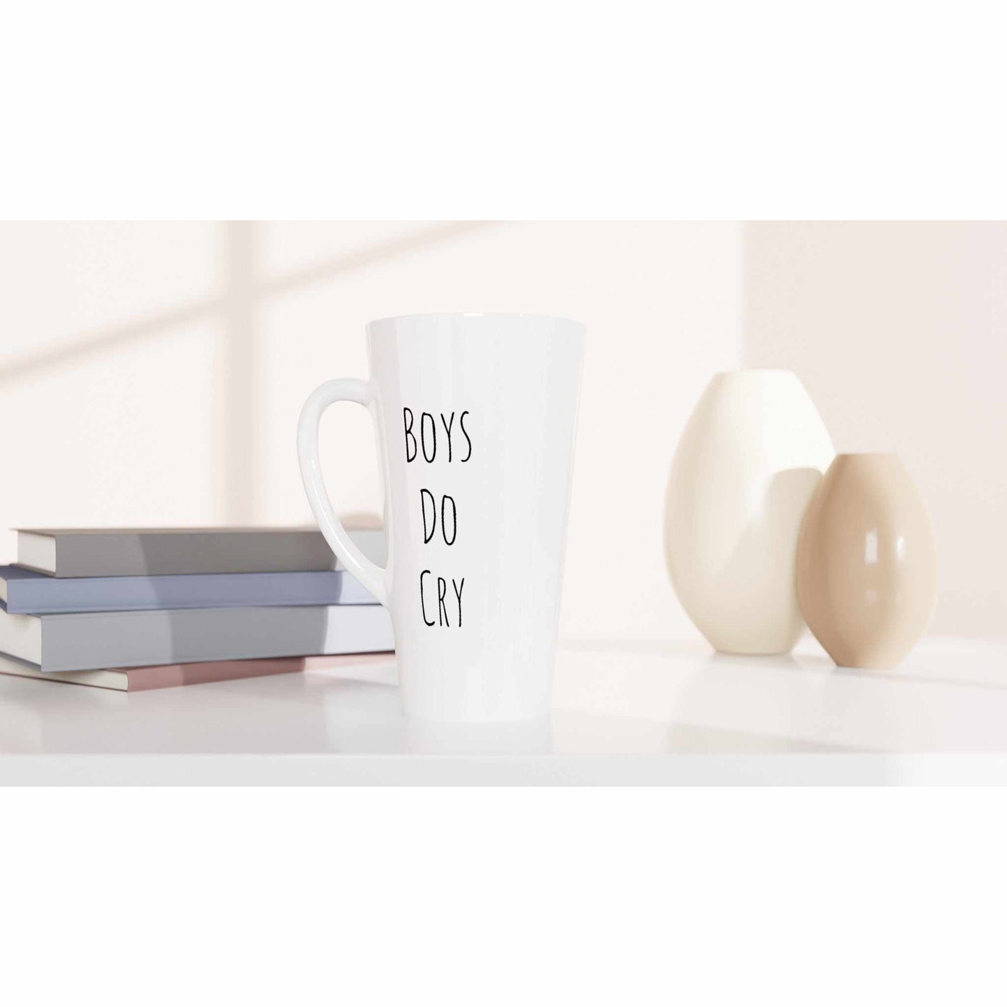 Boys Do Cry White Latte 17oz Ceramic Mug on a table.