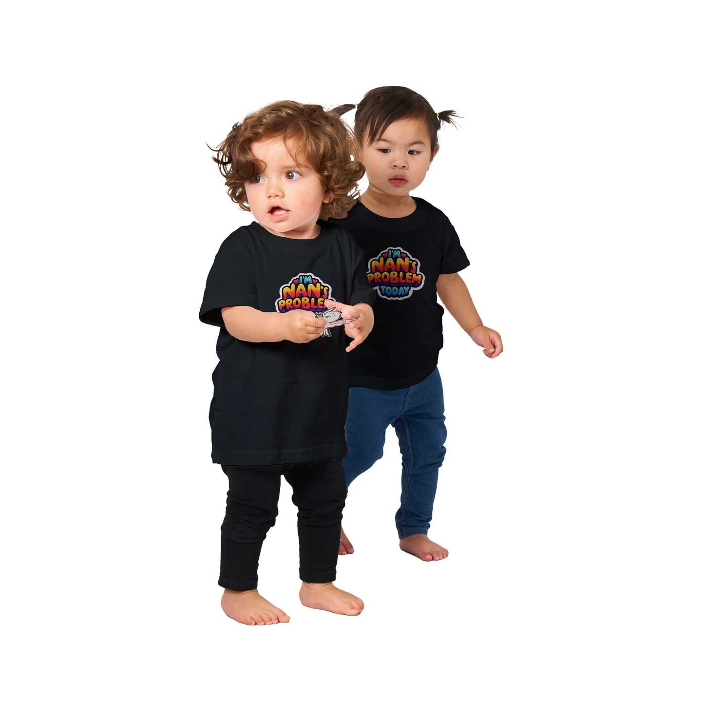 Two toddlers wearing "I'm Nan's Problem Today" baby crewneck t-shirts, black cotton with colorful print.