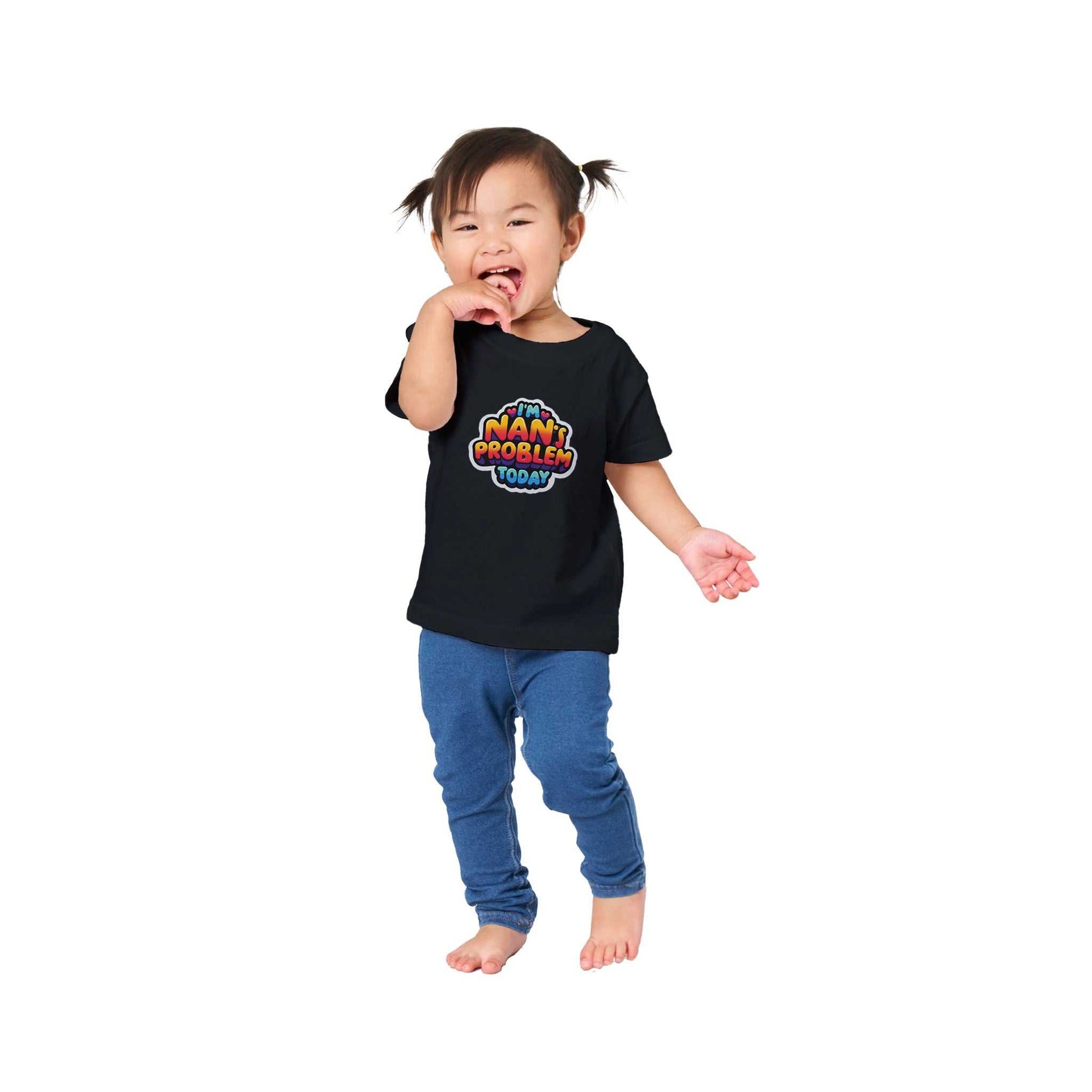 Baby wearing "I'm Nan's Problem Today" crewneck t-shirt, black, 100% cotton, relaxed fit.