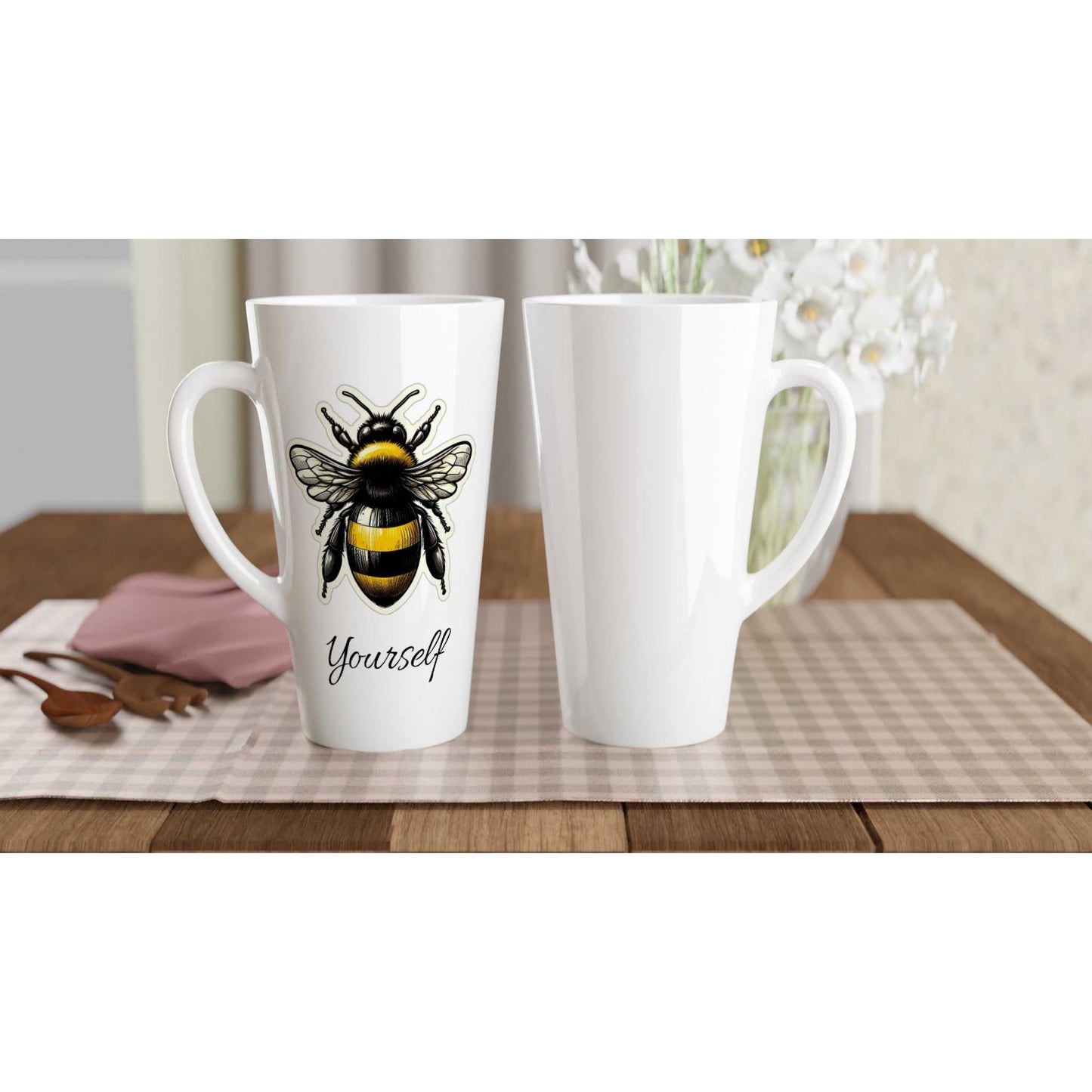 White latte 17oz ceramic mug with bee design, perfect for hot beverages, dishwasher and microwave safe.