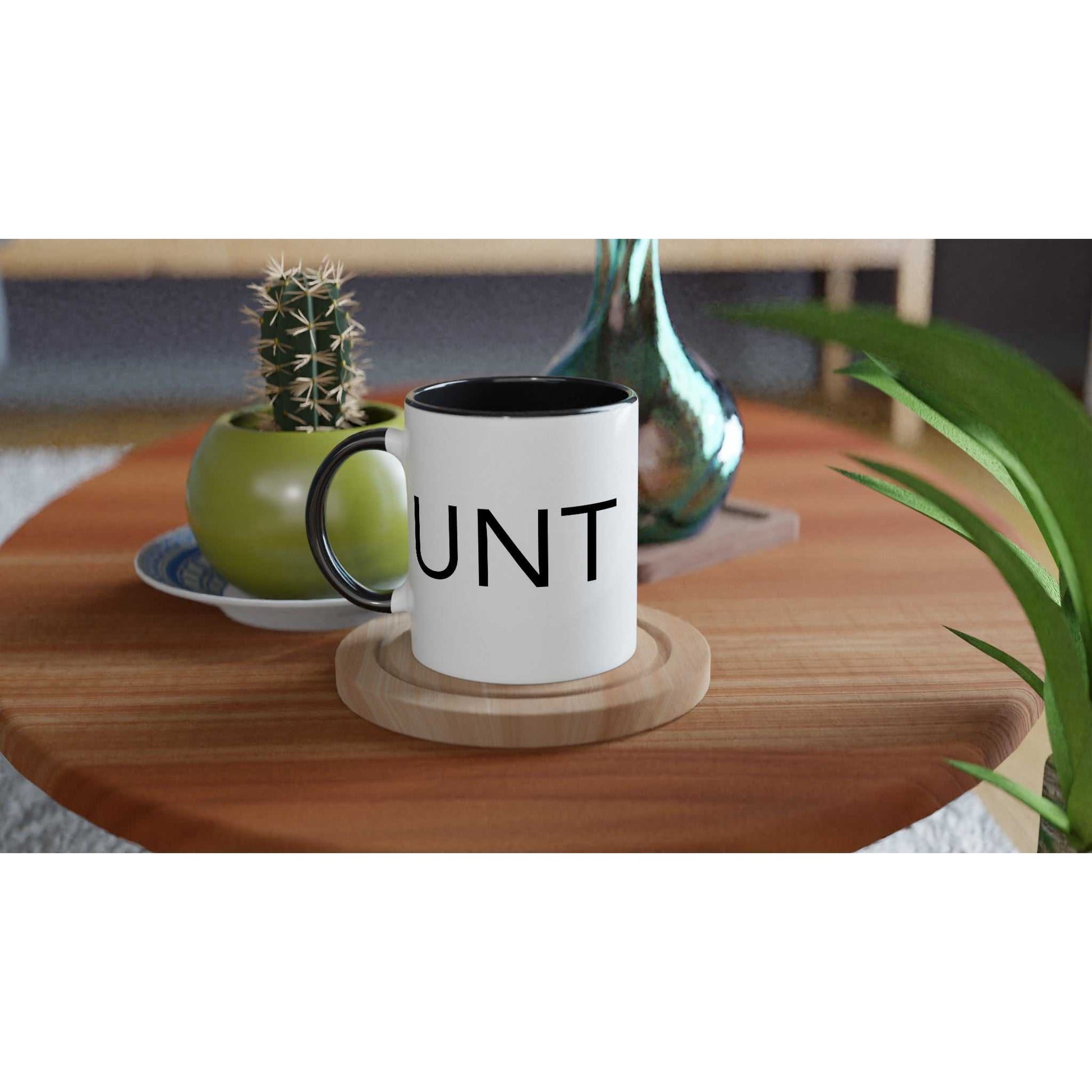 #UNT White 11oz Ceramic Mug with Black Handle and Inside on wooden table.