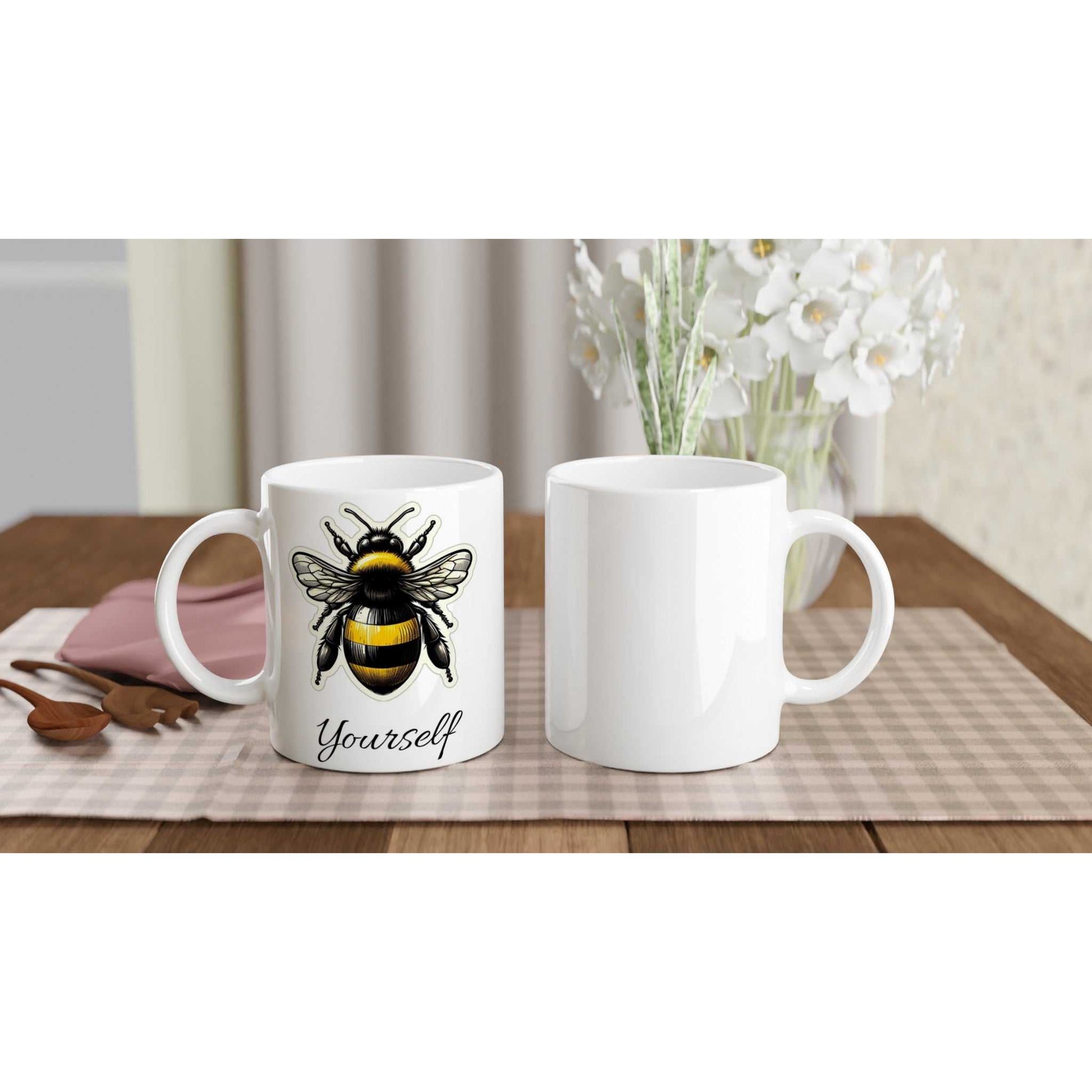 White 11oz Ceramic Mug with Bee Yourself Design on Table