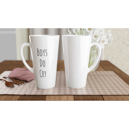 Boys Do Cry White Latte 17oz Ceramic Mug on table, microwave and dishwasher safe.