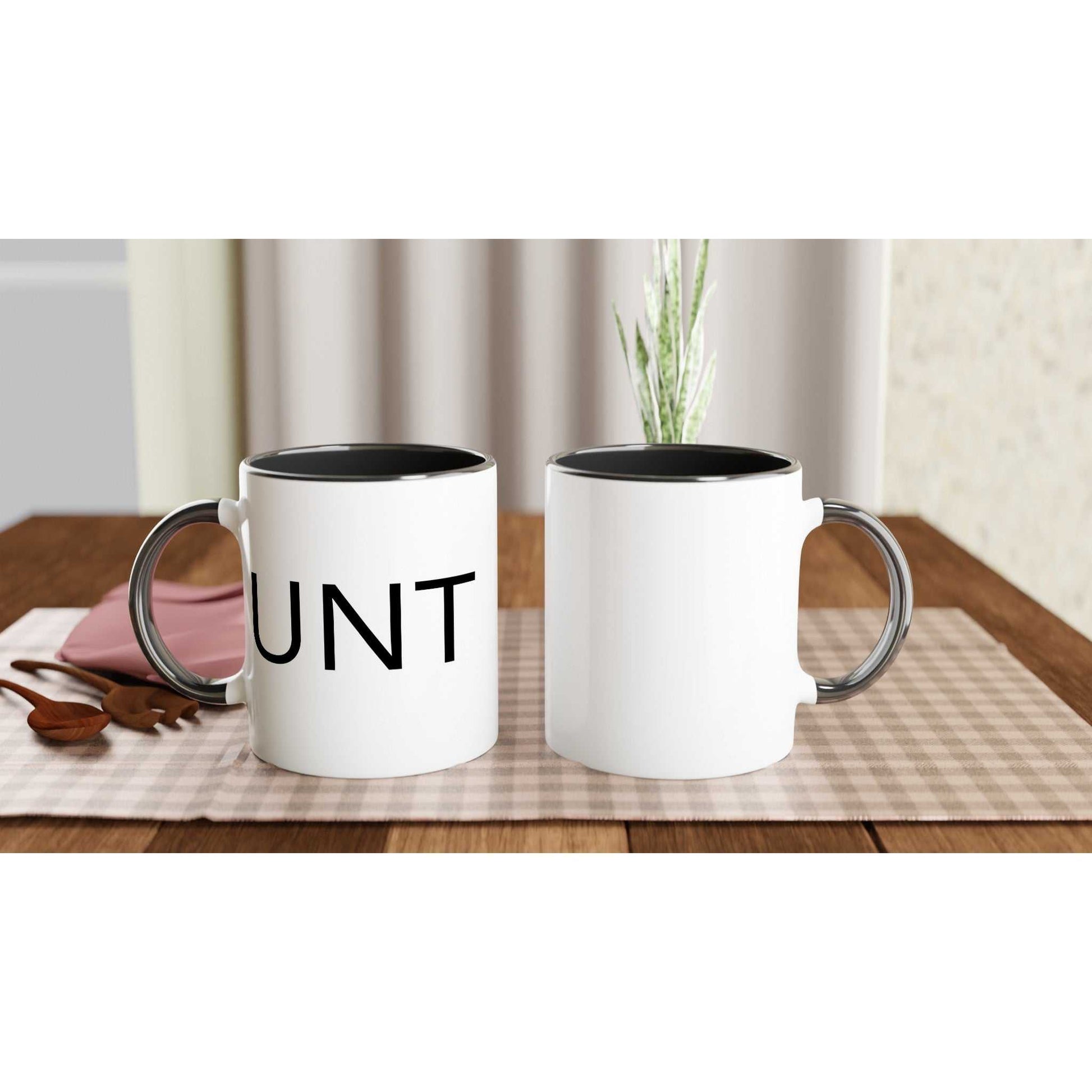 #UNT White 11oz Ceramic Mug with Black Handle and Inside on table.