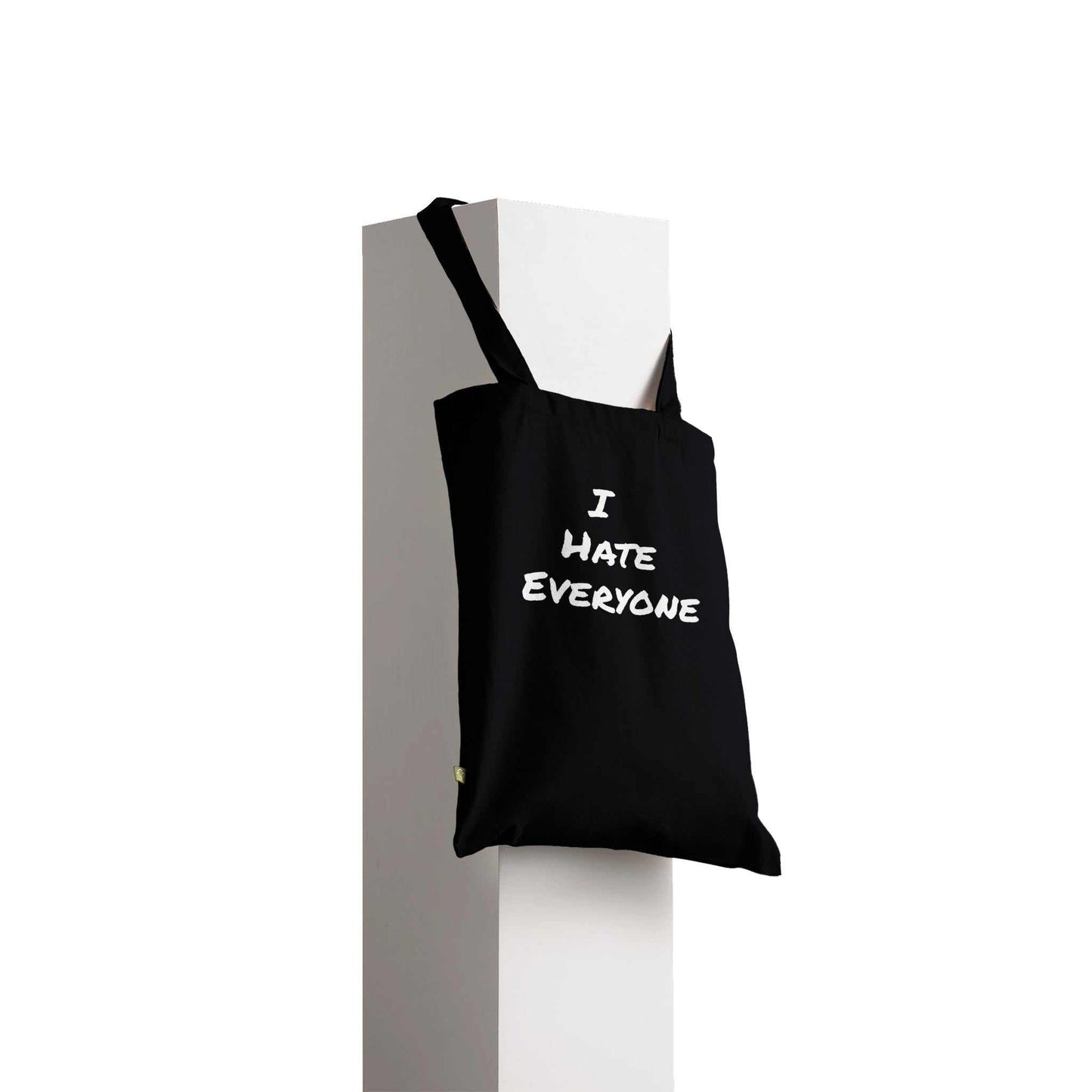 Black premium tote bag with "I Hate Everyone" text, reinforced handles, eco-friendly 100% cotton.