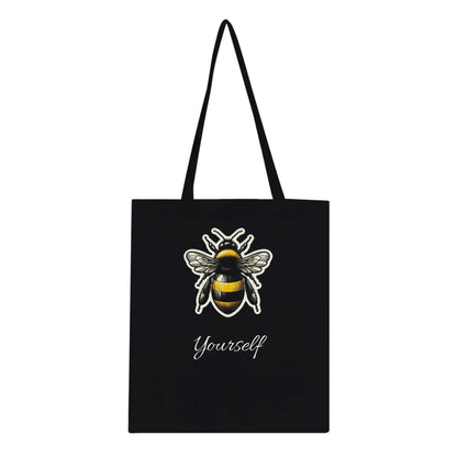 Black tote bag with a bee design and the text "Yourself," featuring long handles and reinforced stitching, eco-friendly and 100% cotton.