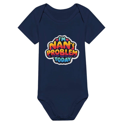 "I'm Nan's Problem Today" baby short sleeve bodysuit in navy blue with colorful text design.