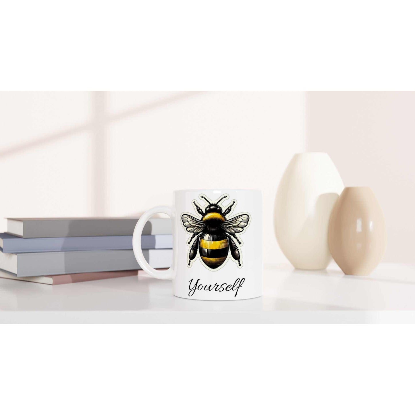 White 11oz ceramic mug with bee design on a table.