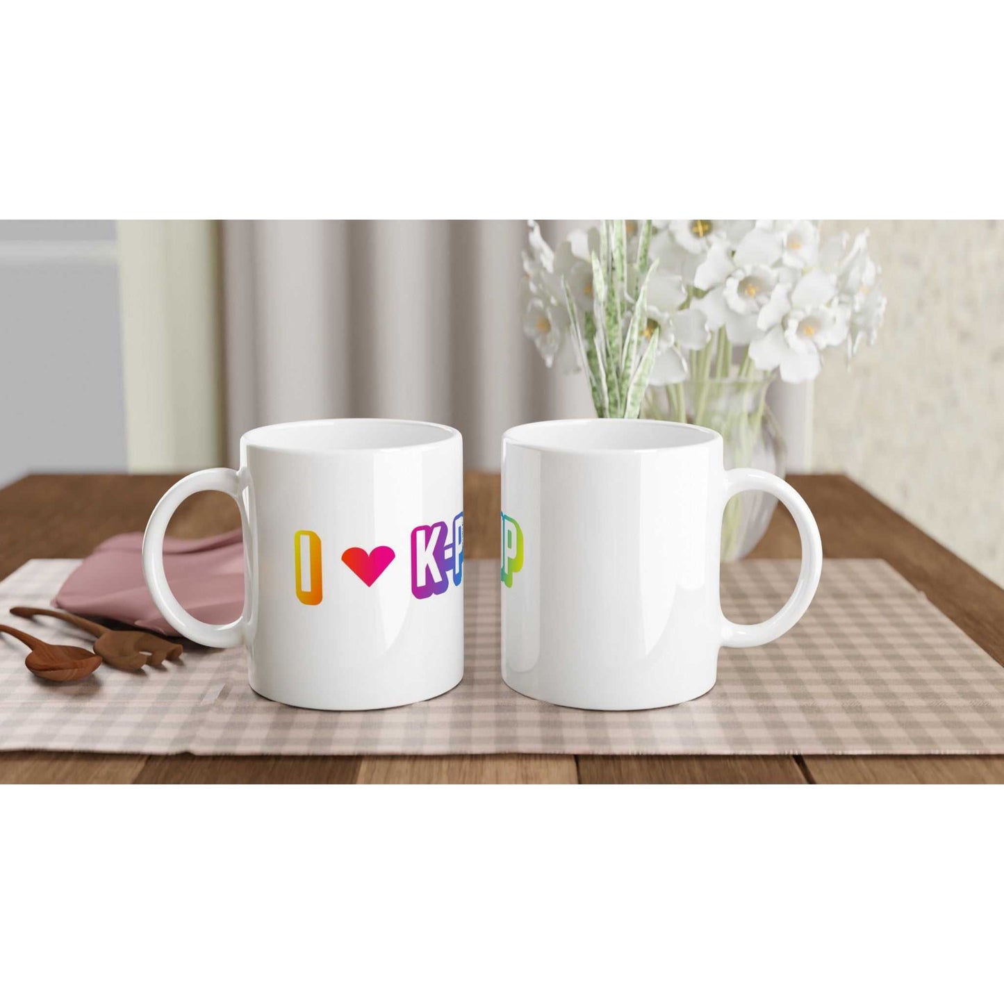 I Love Kpop White 11oz Ceramic Mug on table, showing colorful print, glossy finish.