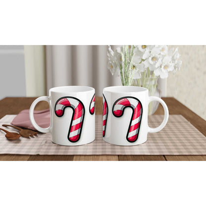 Candy Cane 11oz Ceramic Mug with vibrant red and white design on a glossy white finish, displayed on a table.