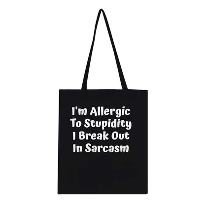 Sarcasm Classic Tote Bag with witty text about being allergic to stupidity, made of 100% cotton with reinforced handles.