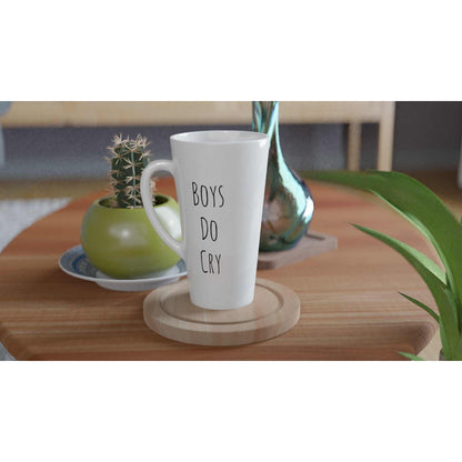 Boys Do Cry White Latte 17oz Ceramic Mug on wooden table with plants