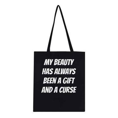 Eco-conscious cotton tote bag with "My Beauty Has Always Been A Gift And A Curse" design, reinforced handles.